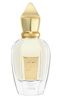Perfume bottle with gold cap and clear body on a white background
