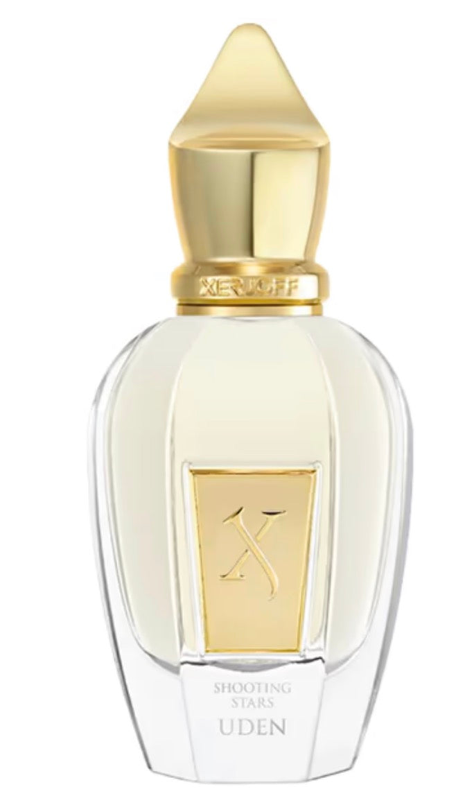 Perfume bottle with gold cap and clear body on a white background