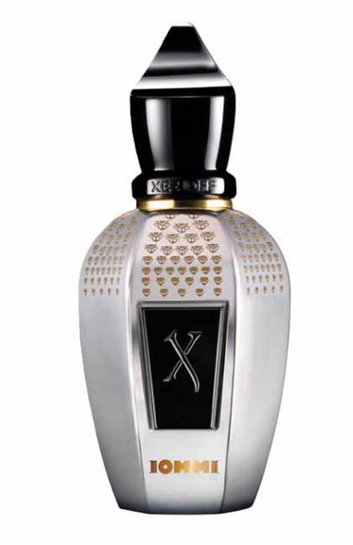 Perfume bottle with decorative design and 'X' symbol on a white background