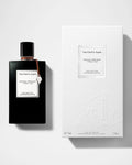 Van Cleef & Arpels perfume bottle and packaging on a light gray background